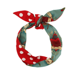 Red and teal polka dot and floral print satin headband tied in a knot with ears