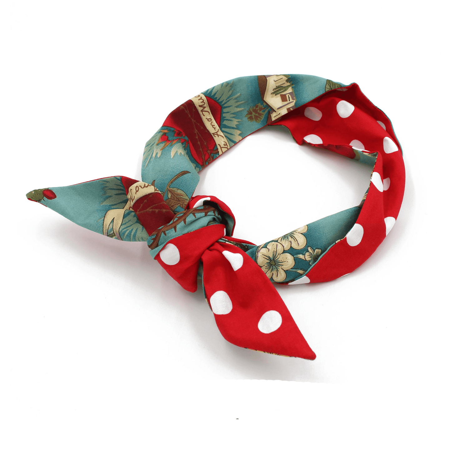 Red and teal polka dot and floral print satin headband tied in a knot with ears, angled view