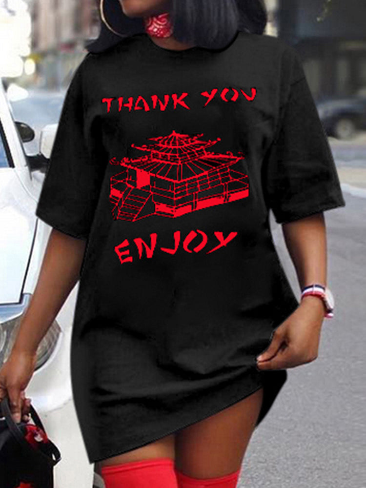 Woman wearing a black t-shirt dress with red graphic print and red thigh-high socks