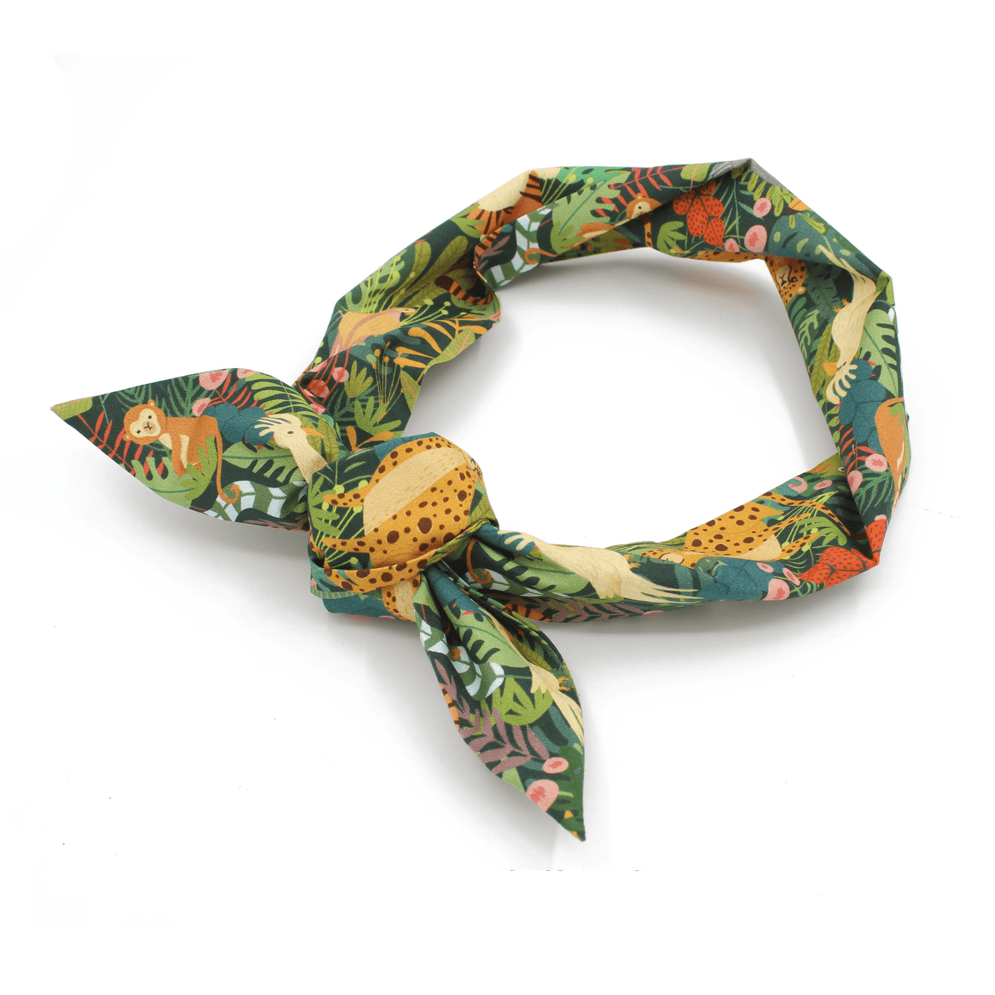 A green jungle print headband tied in a knot, viewed from an angle.