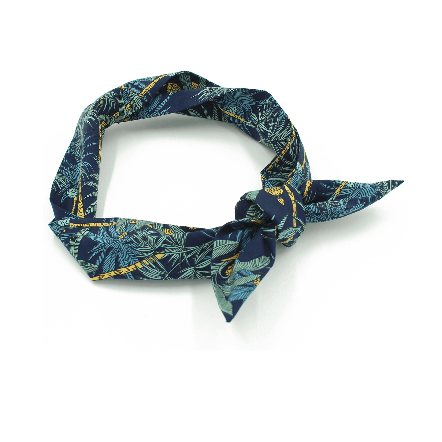 Navy blue headband with a tropical print, tied in a knot on the side.