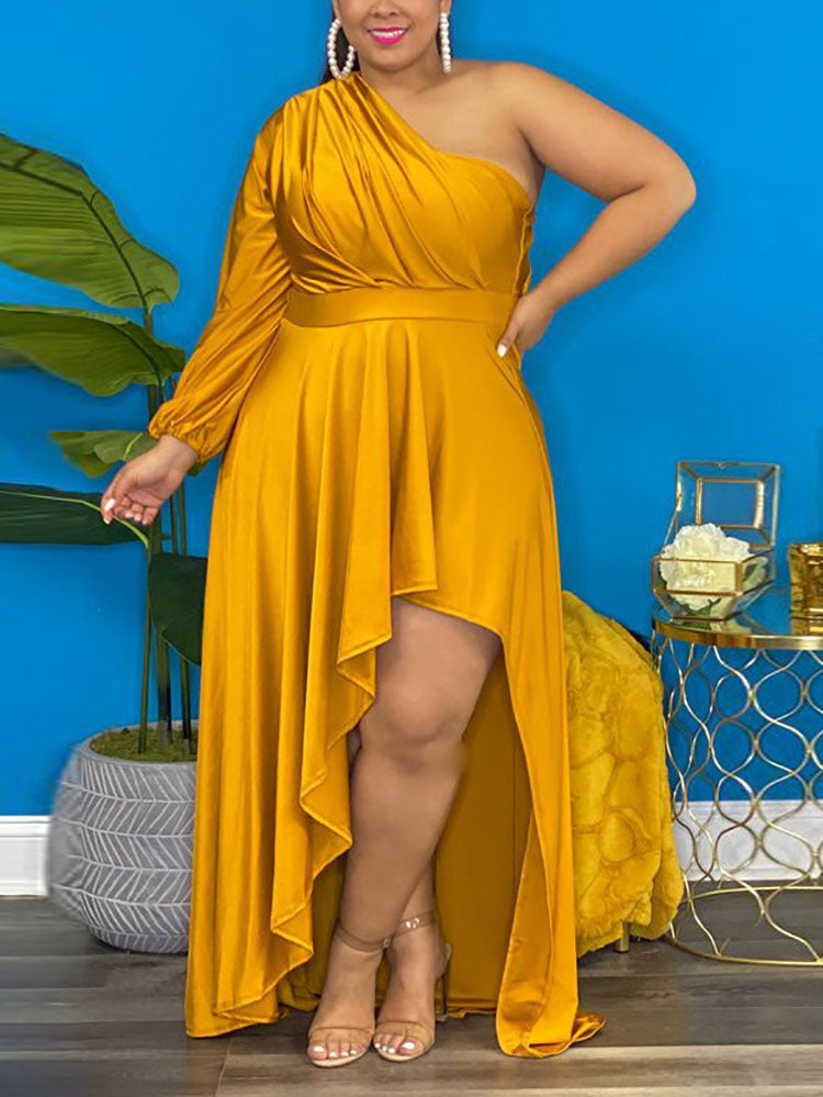 Woman wearing a mustard yellow one-shoulder high-low maxi dress with ruched detailing and a long sleeve on one side.
