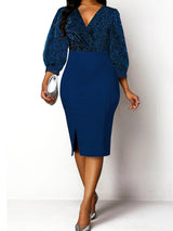 Woman wearing a blue sequined v-neck bishop sleeve sheath dress with a pencil skirt and side slit, holding a silver clutch.