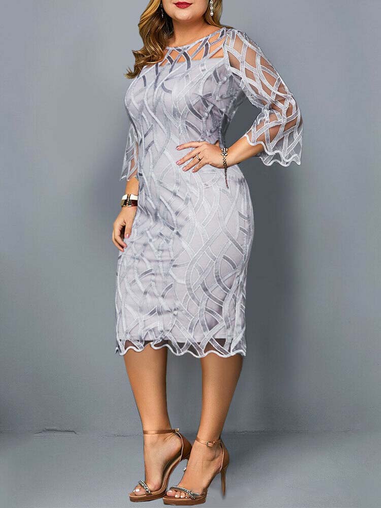 Side view of a plus-size model in a light grey lace sheath dress with geometric overlay.