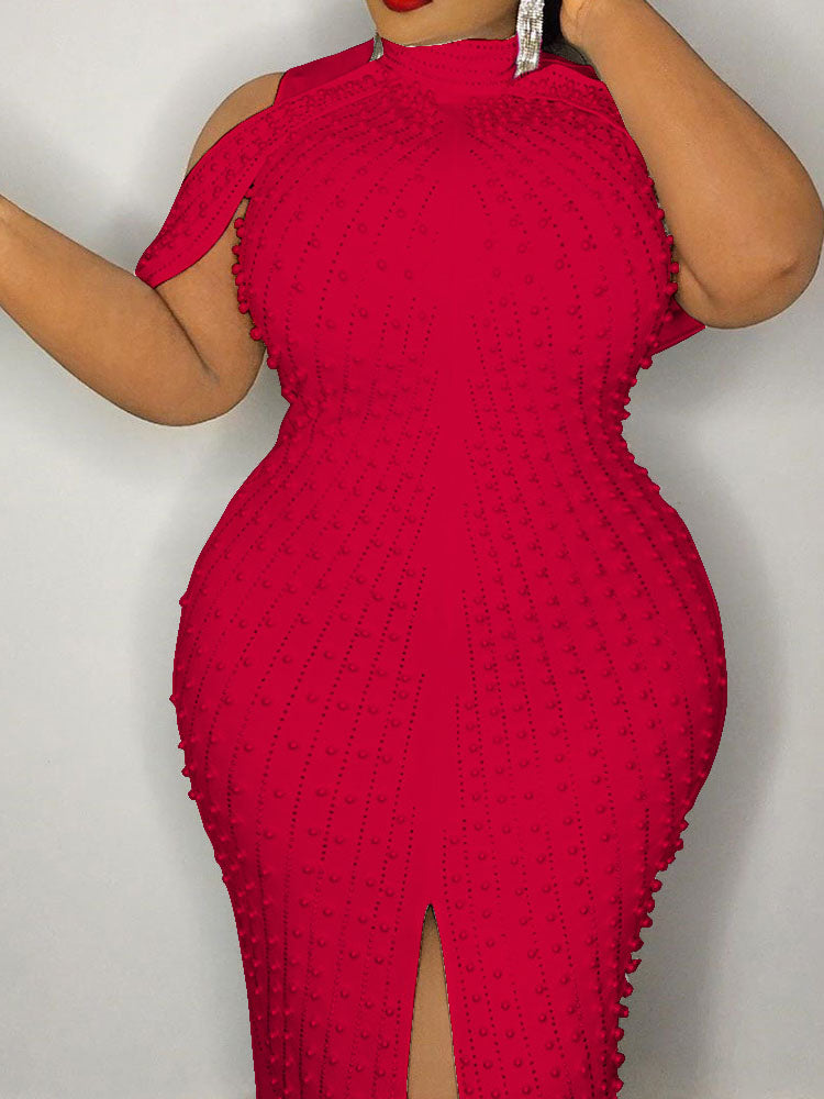 Close-up of a red embellished sheath dress showcasing texture and detail