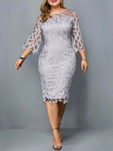Plus-size model wearing a light grey lace sheath dress with bell sleeves and a round neckline.