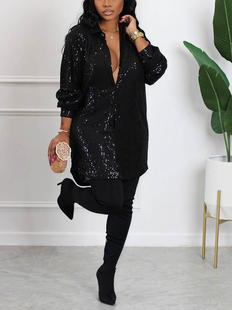 woman wearing a black sequin shirt dress with black thigh-high boots and a gold clutch