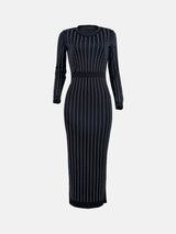 Front view of a black long-sleeved midi dress with vertical rhinestone embellishments and a crew neckline.