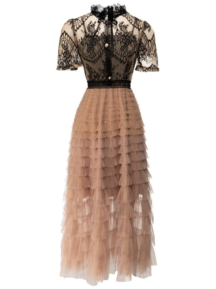 Black and tan lace and tulle tiered dress displayed
