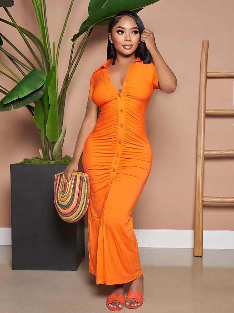 Woman wearing an orange ruched button-down maxi dress