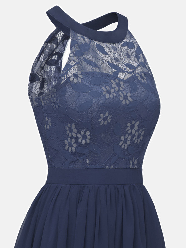 Close-up of the halter neckline and lace detail of the navy blue dress