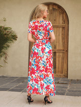 Back view of a woman in a floral print maxi dress.