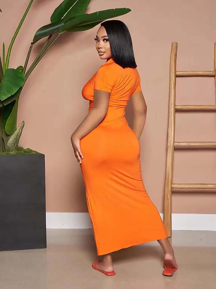 Back view of a woman wearing an orange ruched button-down maxi dress