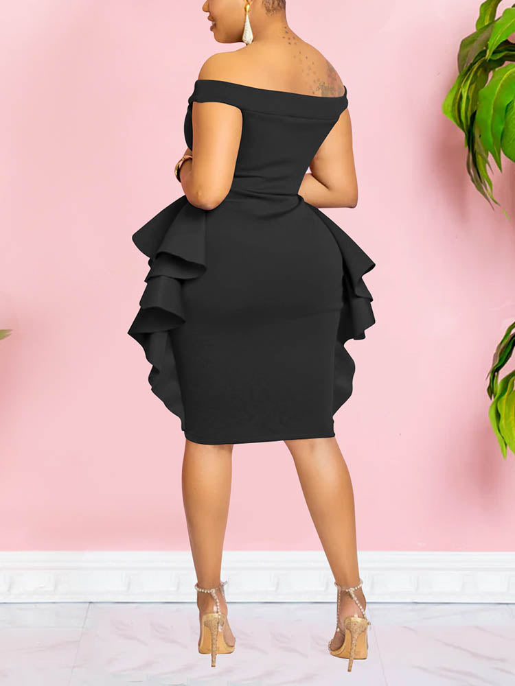 Back view of a woman wearing a black off-the-shoulder dress with ruffle details and an asymmetrical hemline.