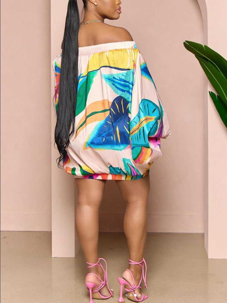 Side view of a woman showcasing the balloon sleeves and mini length of the floral print dress.