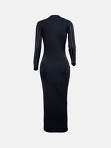 Back view of a black long-sleeved midi dress with vertical rhinestone embellishments on the sleeves.