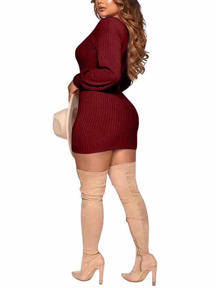 Rear view of a woman in a dark red ribbed knit mini dress with bishop sleeves and a ruched side detail.