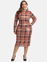 Woman wearing a sequined plaid pencil dress with long sleeves and a mock neck, standing against a white background.