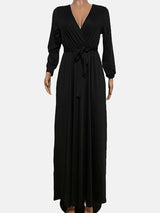 Black long-sleeve maxi wrap dress displayed on a mannequin against a white background.