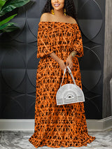 Woman wearing an orange off-the-shoulder maxi dress with a geometric print and holding a white fan-shaped handbag.