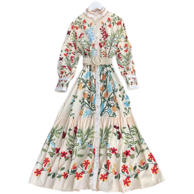Cream floral print maxi dress with long sleeves and a belted waist, displayed on a white background.