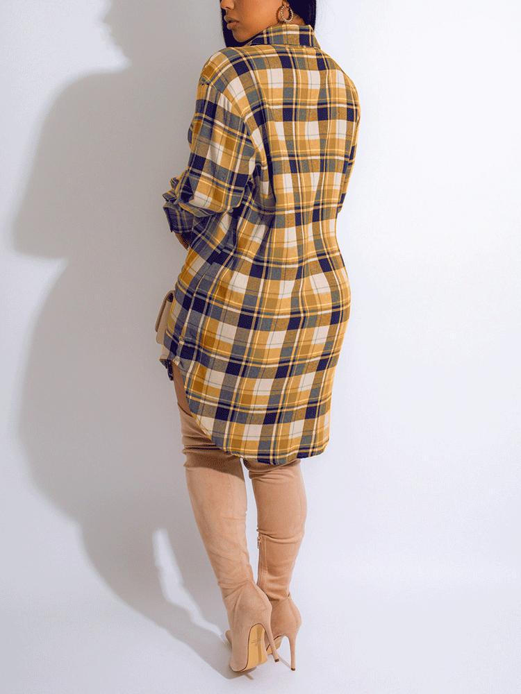 Back view of a woman wearing a yellow and blue plaid shirt dress with thigh-high boots.