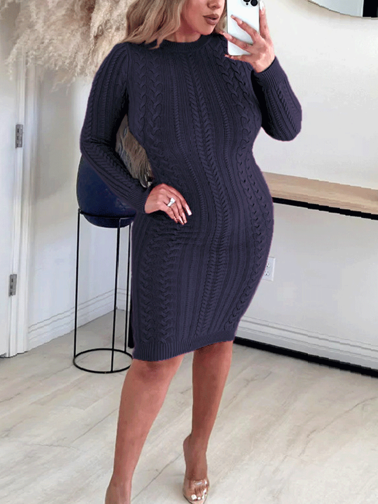 Woman wearing a navy cable knit bodycon dress from the front.