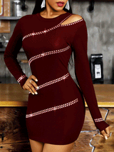 Woman wearing a burgundy long-sleeved bodycon mini dress with diagonal rhinestone embellishments and an asymmetrical cut-out neckline.