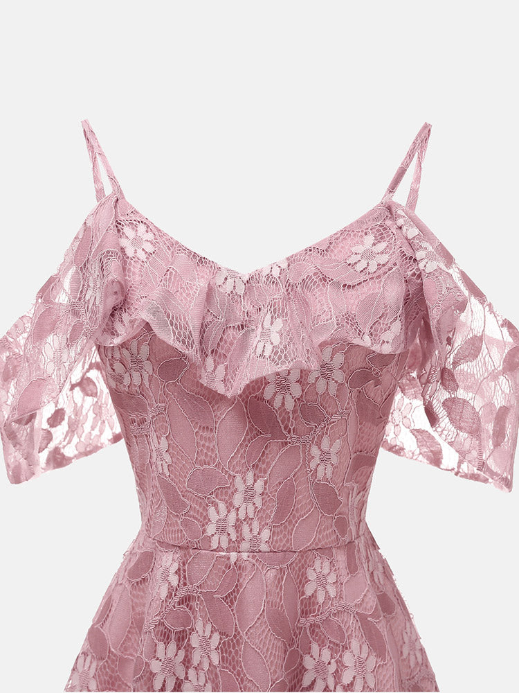 Close-up of the neckline and cold shoulder detail on a pink lace dress