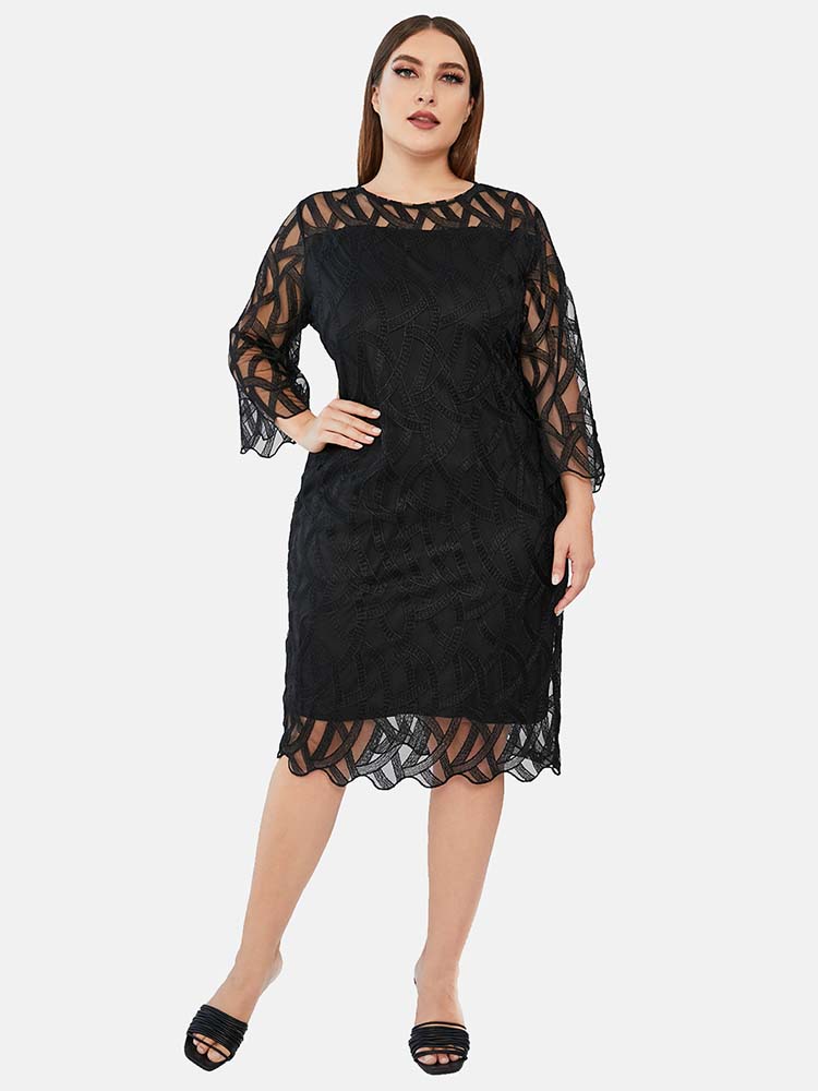 Plus-size model wearing a black lace sheath dress with bell sleeves and a round neckline.