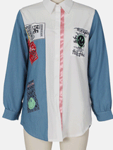 Front view of a colorblock shirt dress with appliqué patches displayed on a mannequin