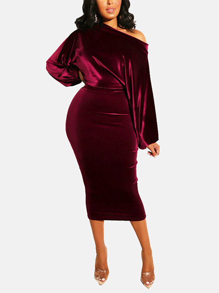 woman in a burgundy velvet off-the-shoulder midi dress with balloon sleeves, full body shot