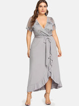 Plus-size navy blue V-neck wrap dress with sequined bodice and ruffle hem
