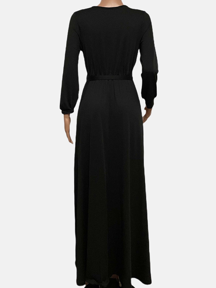 Back view of a black long-sleeve maxi wrap dress on a mannequin.
