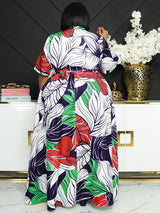 Back view of a woman wearing a floral print maxi dress.