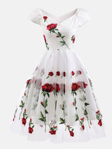 white off-the-shoulder midi dress with embroidered red roses and tulle skirt