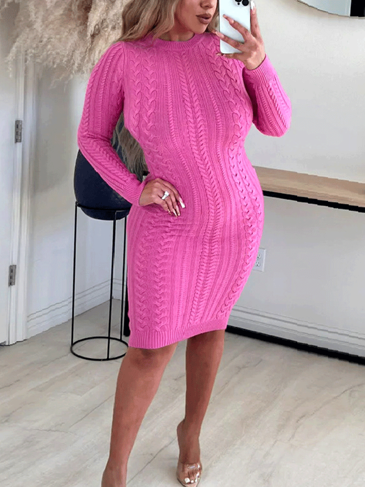 Woman wearing a pink cable knit bodycon dress from the front.