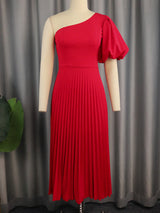 Red one-shoulder midi dress with a pleated skirt displayed on a mannequin.