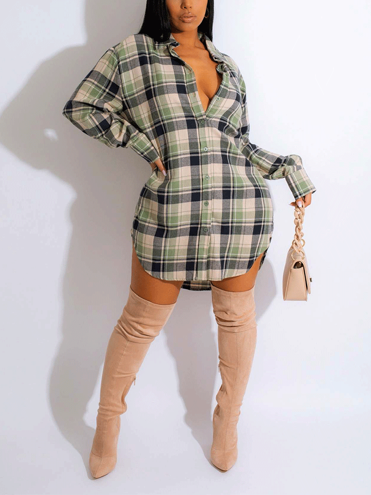 Woman wearing a green and black plaid shirt dress with thigh-high boots.