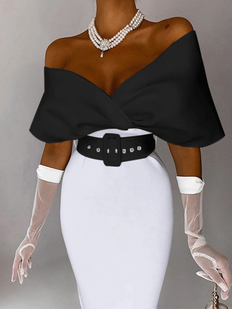 Woman wearing a black off-the-shoulder top with a white pencil skirt, a black belt, white sheer gloves, and pearl necklace.