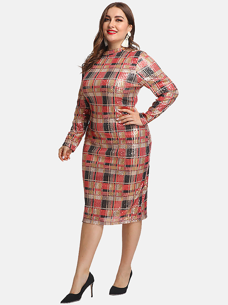 Side view of a woman in a sequined plaid pencil dress with long sleeves and a mock neck.