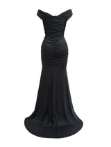 Back view of a black off-the-shoulder ruched formal gown with a high slit