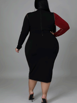 Rear view of a plus size woman showcasing the silhouette of the midi dress