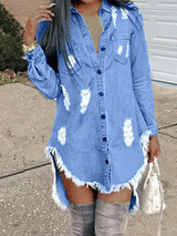 Close-up of a woman in a distressed denim shirt dress with raw hem and grey knee-high boots