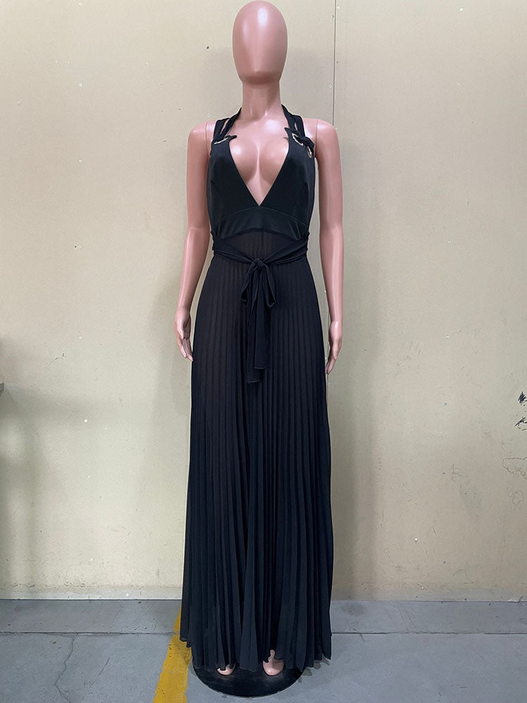 Mannequin displaying a black halter maxi dress with a deep V-neck, tie waist, and pleated skirt, shown from the front.