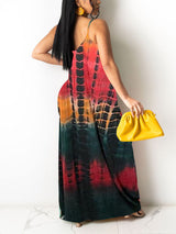 Back view of a woman wearing a tie-dye print maxi dress with spaghetti straps.