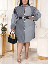 Woman wearing a navy and white striped long-sleeve shirt dress with a black belt and clear heels.