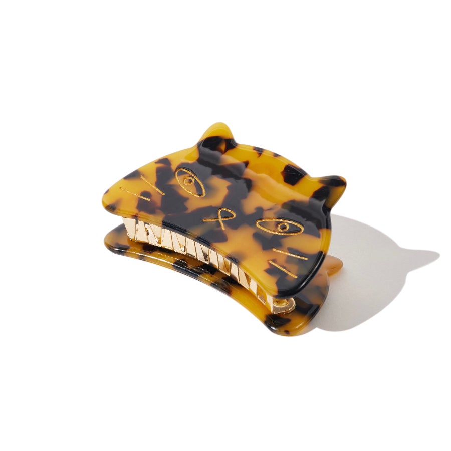 Angled view of tortoiseshell cat face hair claw clip