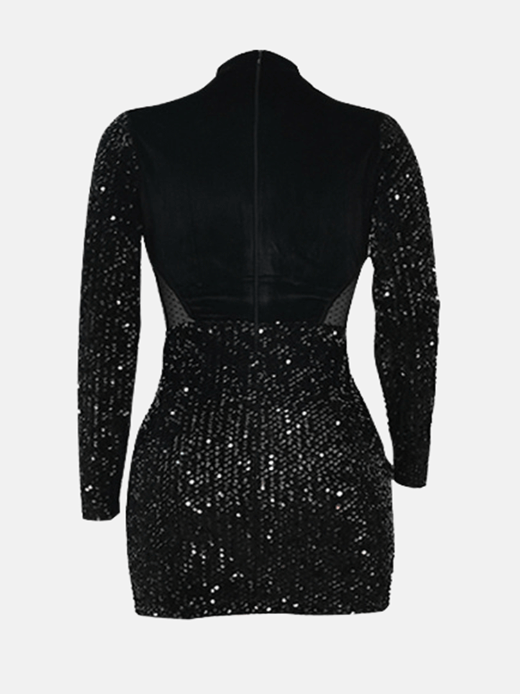 Back view of a black sequined mini dress with velvet bodice and long sleeves.