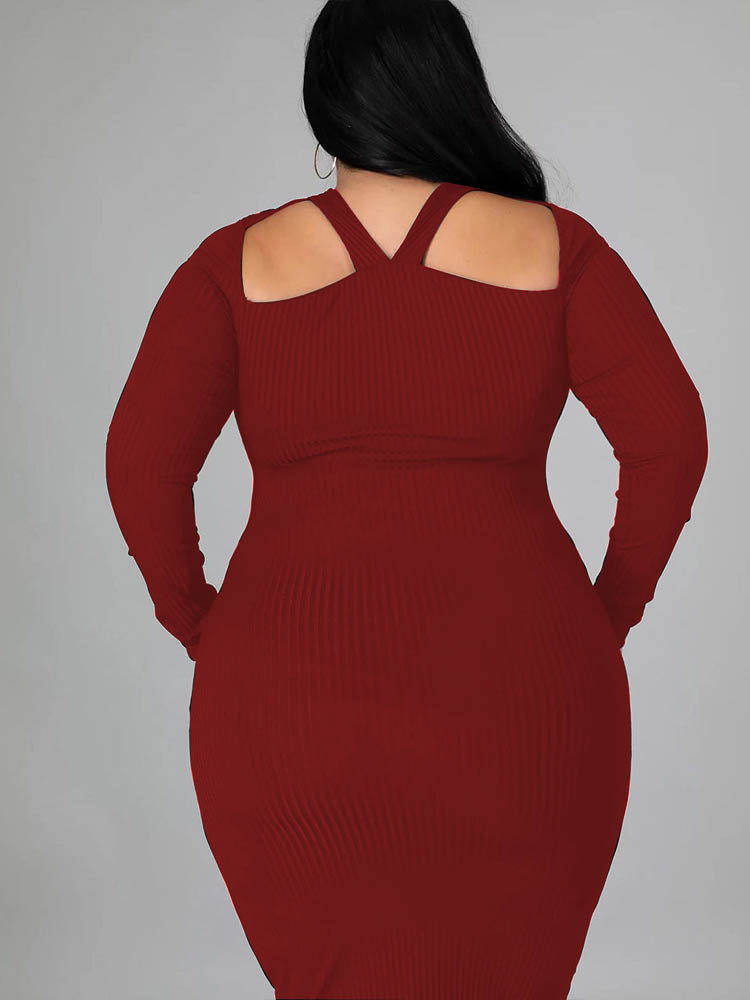 Rear view of a woman wearing a burgundy long-sleeved ribbed knit bodycon dress with a cutout neckline.